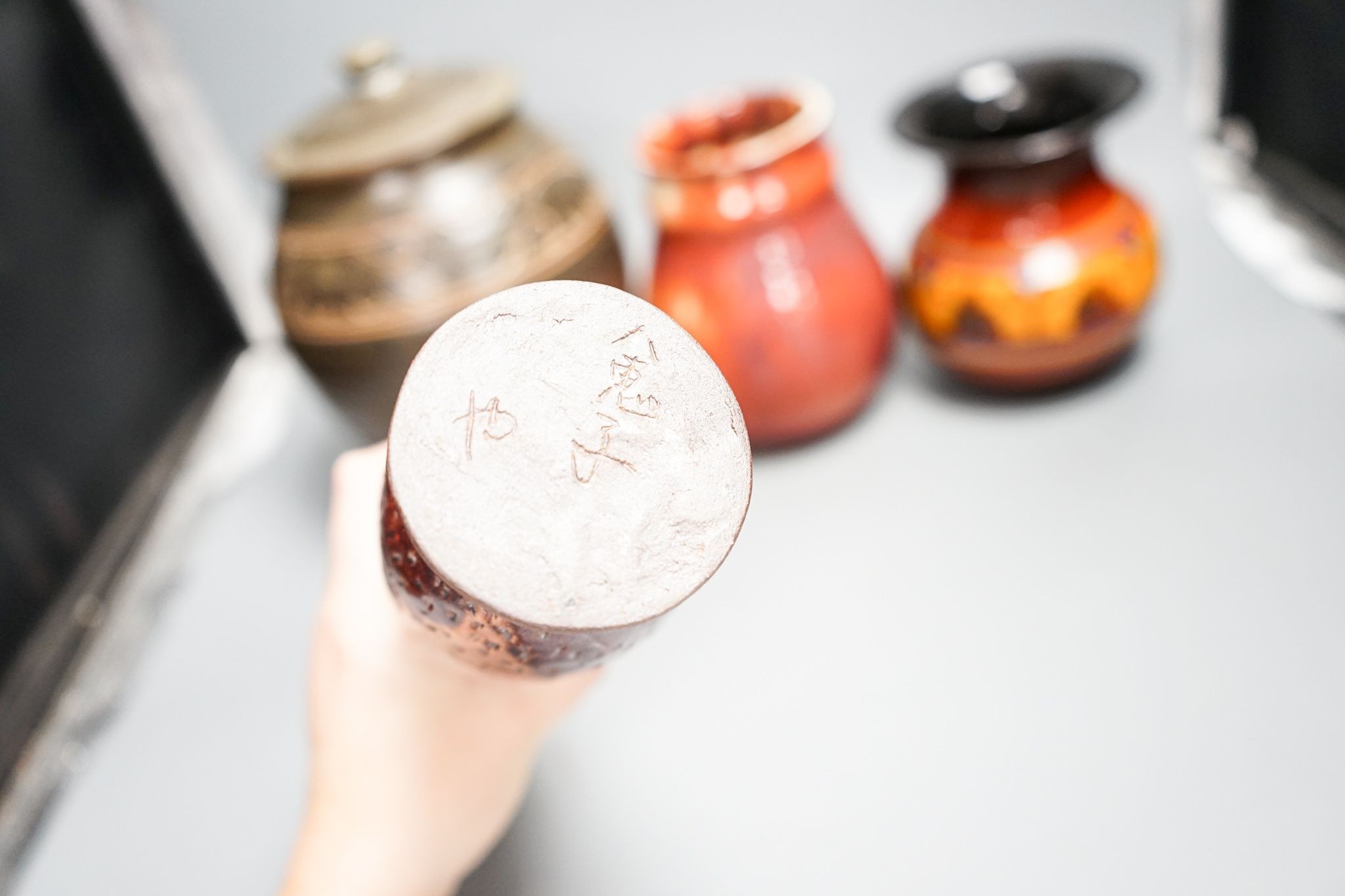 A group of studio pottery including a jar and cover, probably Norah Braden, 25 cm